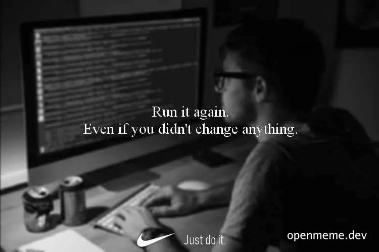 programmer working on computer with code on screen and Nike logo