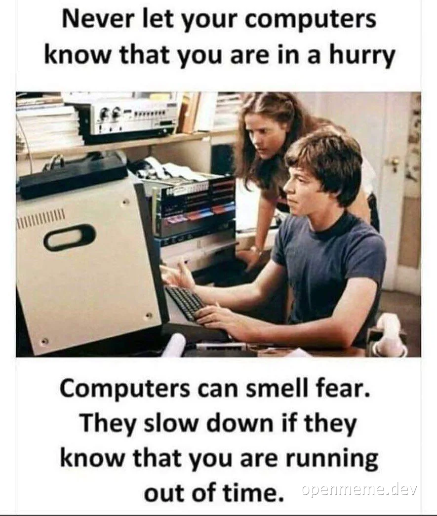 a man and woman looking at a computer with a humorous caption about computer performance