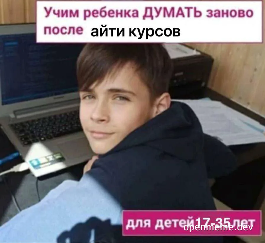 Teenager sitting at desk with laptop, looking puzzled