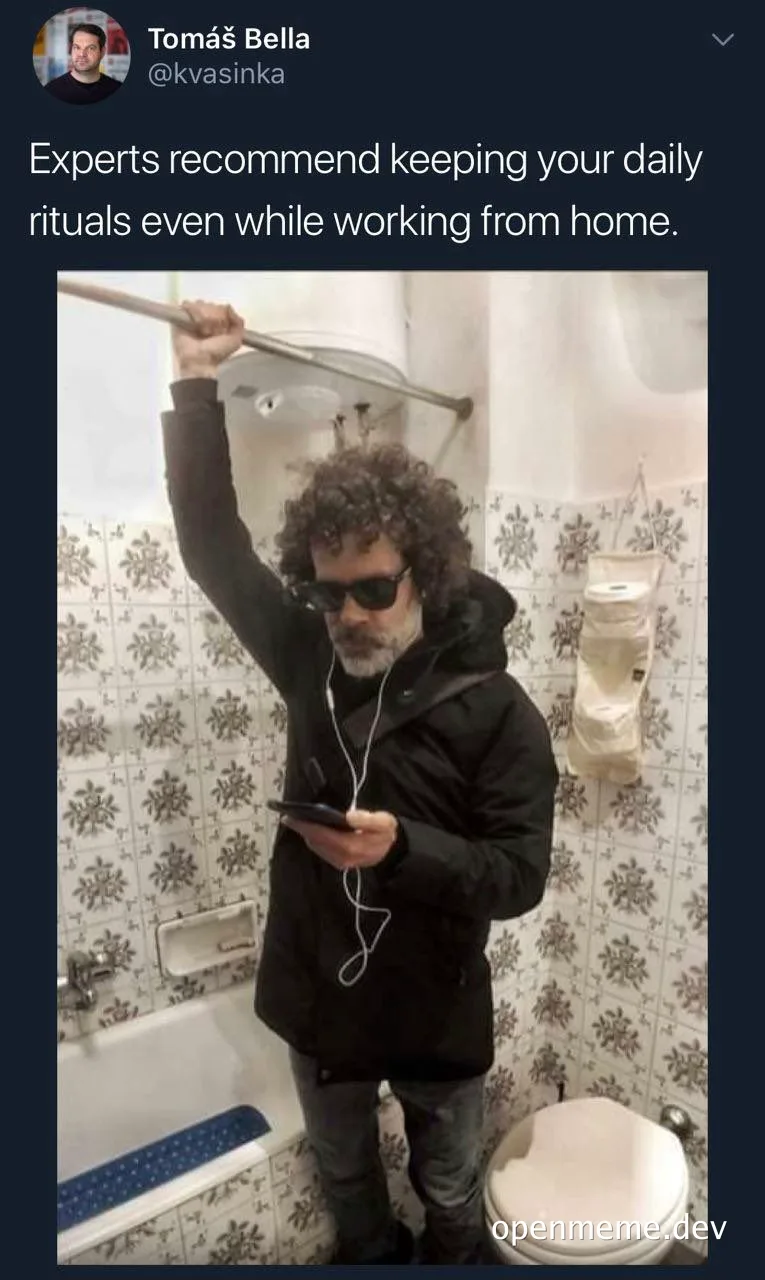 man in black jacket brushing teeth in bathroom while looking at phone