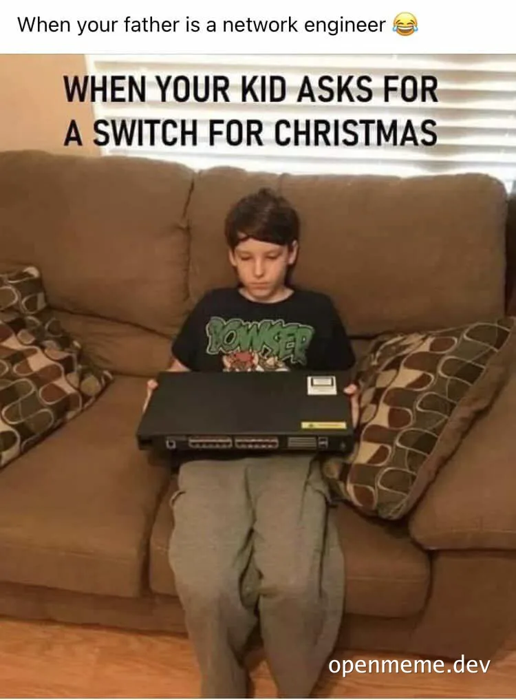 a boy sitting on a couch holding a network switch with a disappointed expression