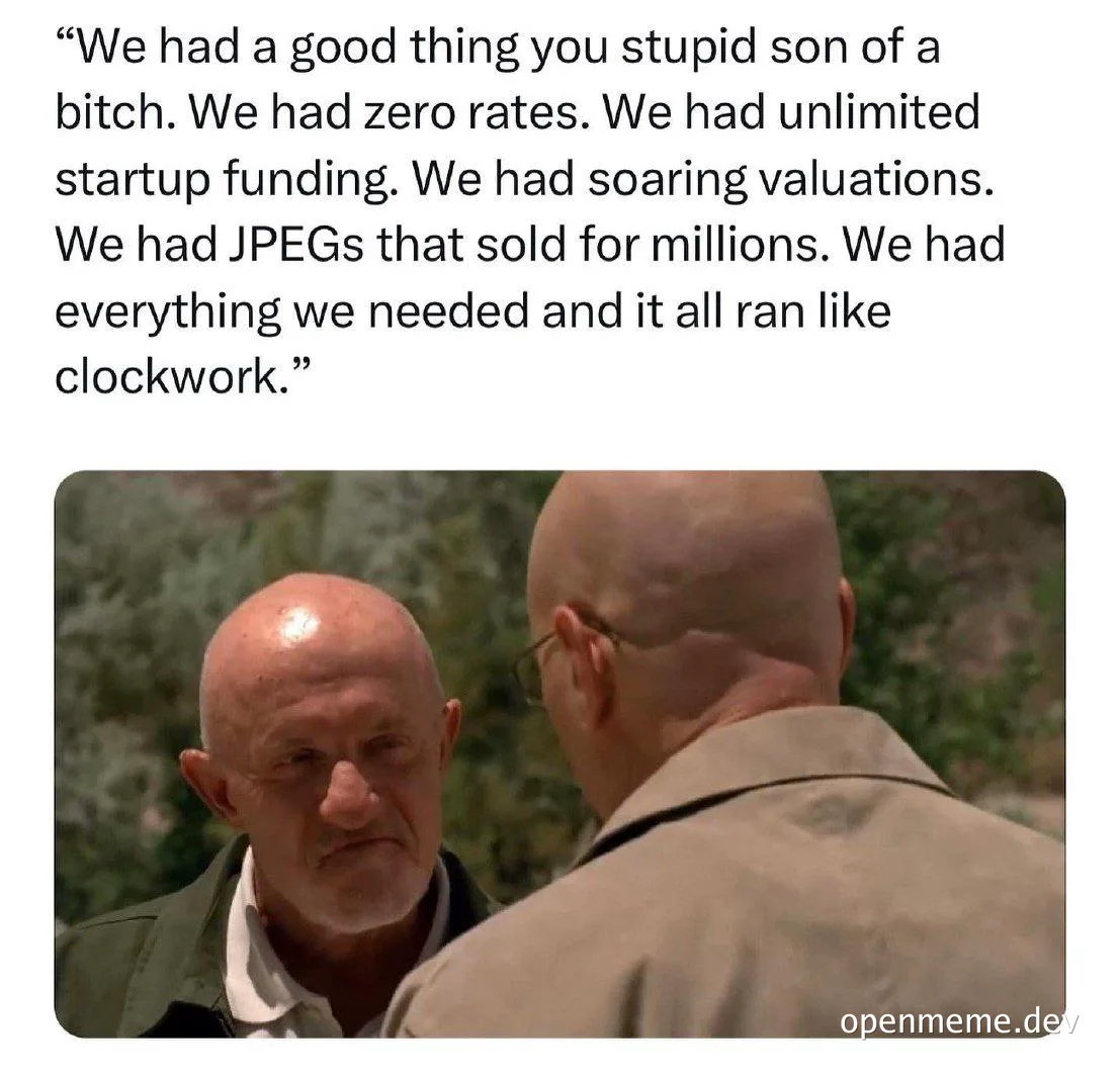 Balding man talking to another bald man with a frustrated expression