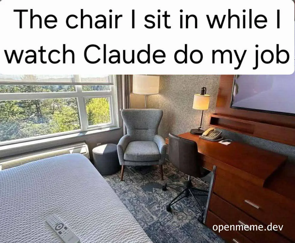 A hotel room with two chairs, one by the window and an office chair at a desk, with text 'The chair I sit in while I watch Claude do my job'