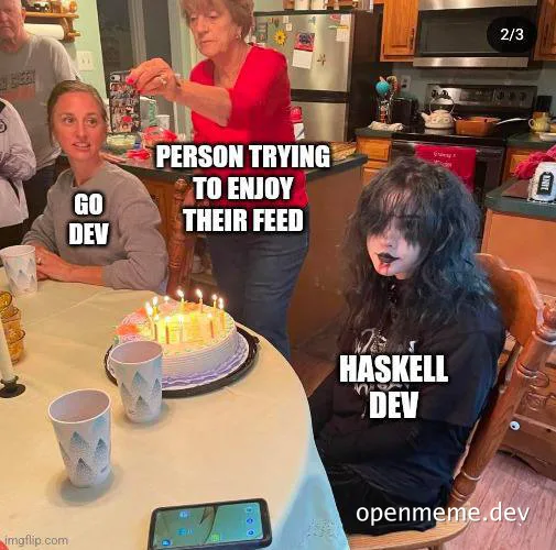 Haskell developer reacting poorly to social media while a friend blows out candles