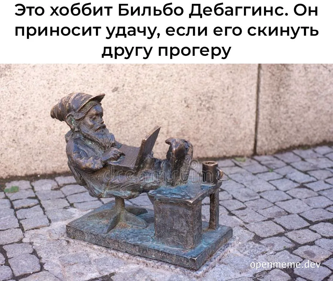 bronze statue of hobbit sitting on chair with laptop