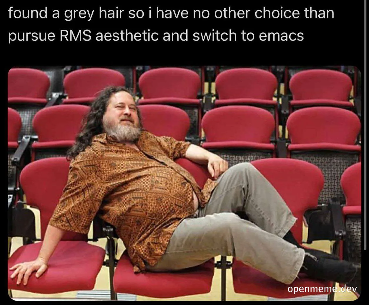 Man reclining in a red chair with a humorous expression, symbolizing a relaxed attitude towards coding aesthetics.