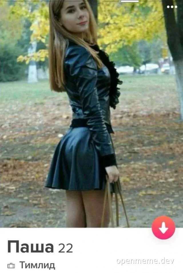 woman in black leather dress standing in park