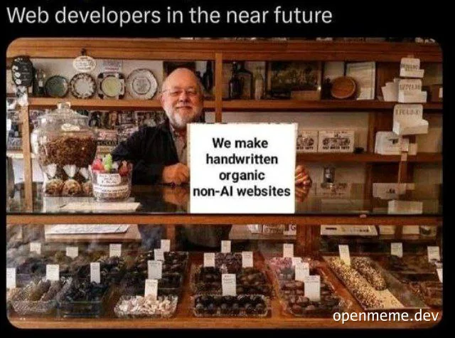 man holding sign that says 'We make handwritten organic non-AI websites'