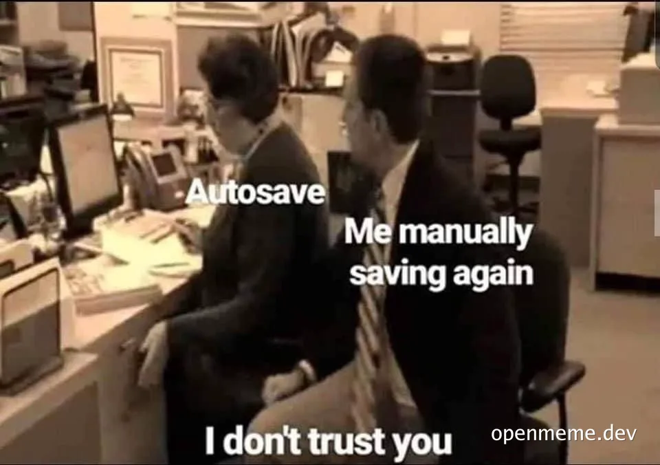 Two businessmen in an office setting with text overlay: 'Autosave' and 'Me manually saving again' with 'I don't trust you' below