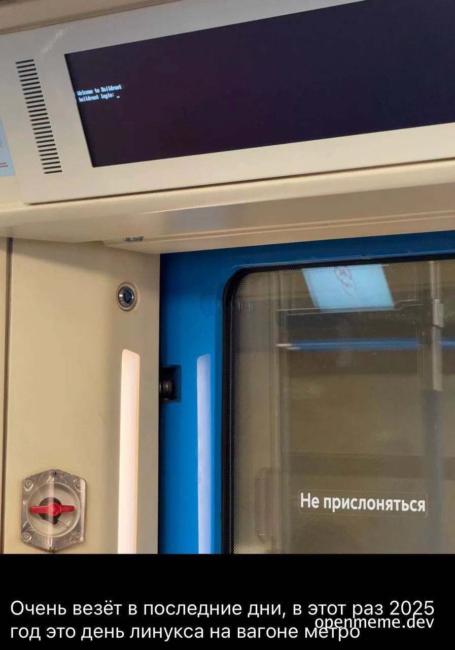 a close-up of a subway door with a screen on the wall