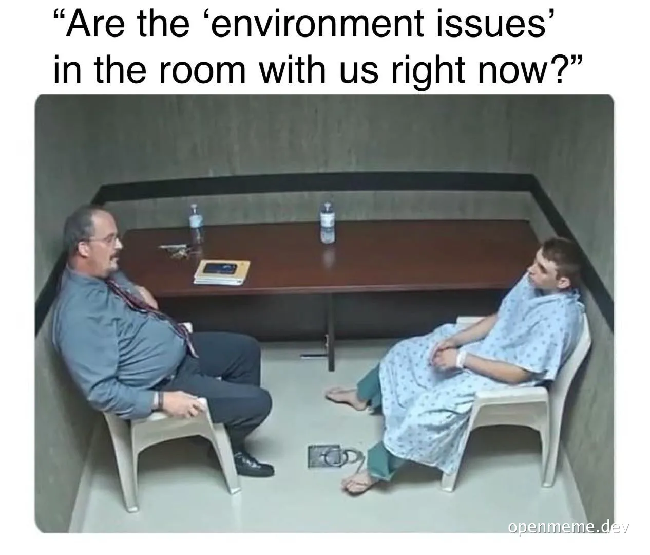 a man and a woman sitting in a room with the caption 'Are the 'environment issues' in the room with us right now?'