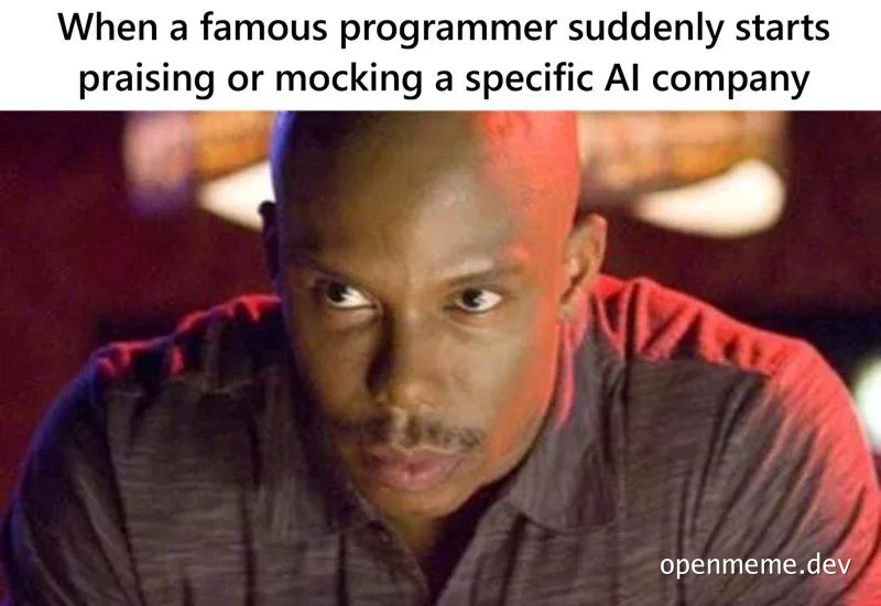 Man with a wary side-eye under red cinematic lighting, captioned about a famous programmer suddenly praising or mocking a
