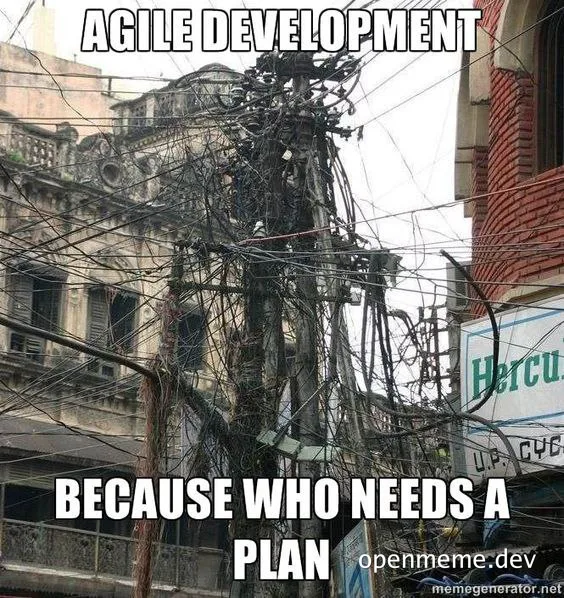 mismanaged electrical wires on a city pole with text 'AGILE DEVELOPMENT BECAUSE WHO NEEDS A PLAN'