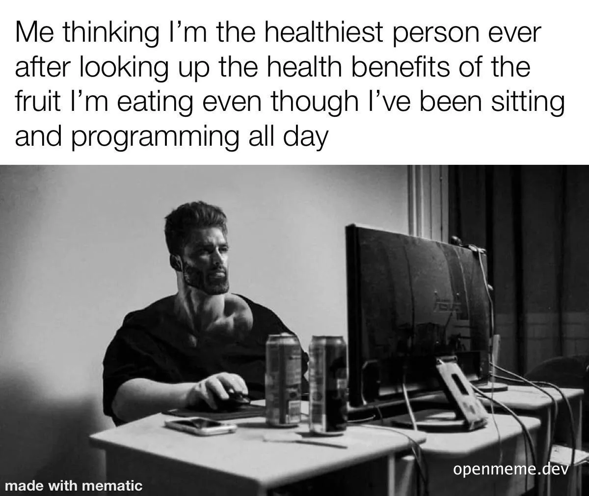 programmer sitting at desk with computer and soda cans thinking he's healthy