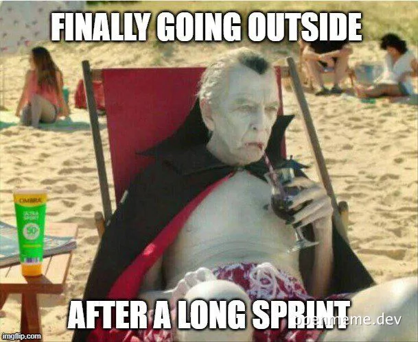 Vampire on beach chair with caption 'FINALLY GOING OUTSIDE AFTER A LONG SPRINT'