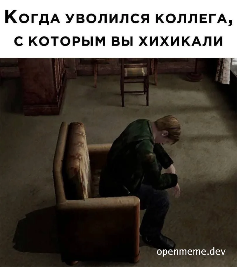 a man sitting on a couch looking down