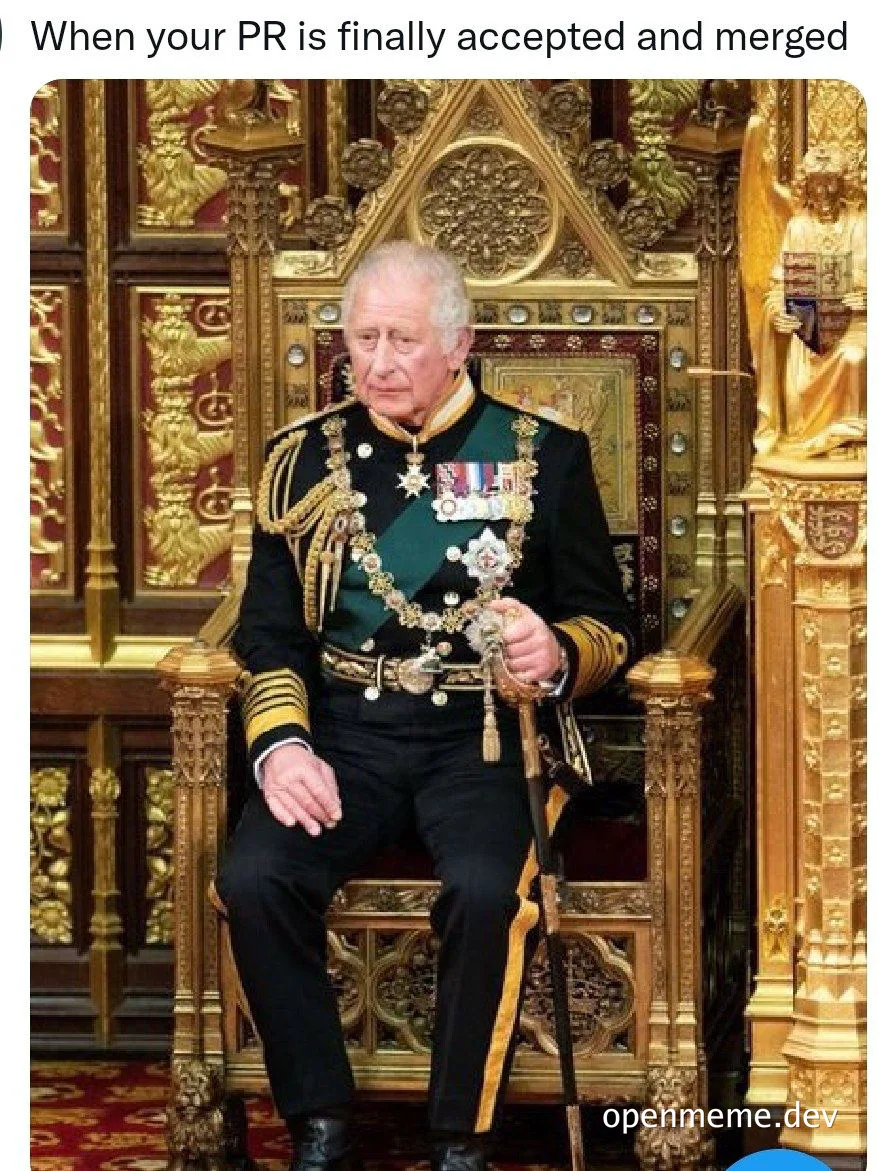 King Charles sitting on a throne looking pleased